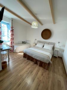 a bedroom with a bed and a table in a room at Torremana in Càbras