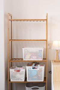 A bed or beds in a room at 1930 French Minimalist Apartment