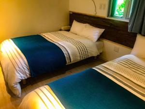 A bed or beds in a room at Niruyakanaya BISE - Vacation STAY 35606v