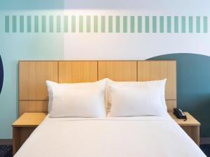 Giường trong phòng chung tại ibis Styles Sydney Central