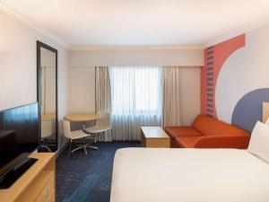 Giường trong phòng chung tại ibis Styles Sydney Central