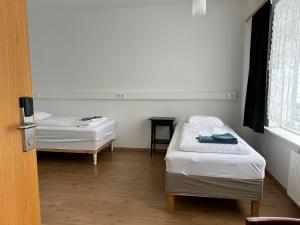 Posteľ alebo postele v izbe v ubytovaní Kanslarinn Hostel