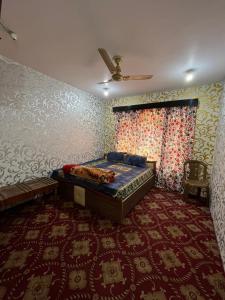 Gulta vai gultas numurā naktsmītnē Hotel Kashmir Heaven