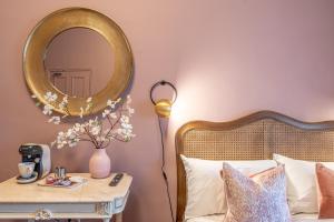 A bed or beds in a room at Boutique Home Stay Blossom