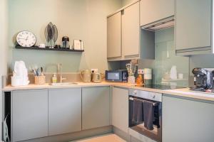 A kitchen or kitchenette at Boutique Home Stay - Bliss Studio