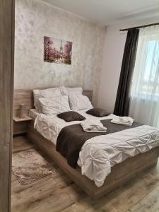 Giường trong phòng chung tại Apartament Rubin