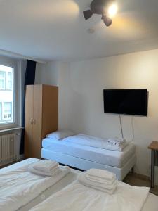 Cama ou camas em um quarto em 24-7 Stadthotel Stuttgart