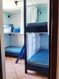 Voodi või voodid majutusasutuse Santa Catarina Hostel toas