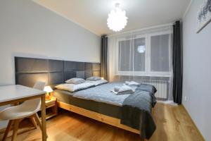 Ліжко або ліжка в номері Apartament Dzień Dobry 3