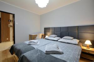 Ліжко або ліжка в номері Apartament Dzień Dobry 3