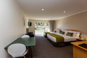 Voodi või voodid majutusasutuse Aspen Court Motel Taihape toas