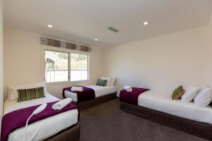 Voodi või voodid majutusasutuse Aspen Court Motel Taihape toas