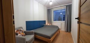 Posteľ alebo postele v izbe v ubytovaní Oak Apartament Rumia Aquapark