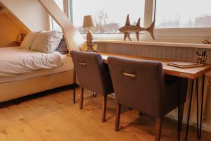 Cama ou camas em um quarto em B&B Zee-en-Zo Noordwijk