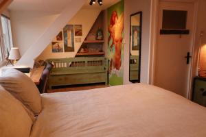 Cama ou camas em um quarto em B&B Zee-en-Zo Noordwijk