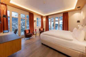 Кровать или кровати в номере Belvedere Swiss Quality Hotel