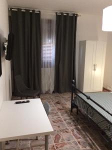 Una cama o camas en una habitación de CasaGiulia2Apartament