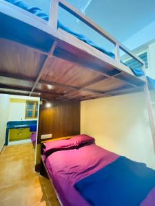 a bedroom with two bunk beds in a room at VEE CEE TOWER FURNISHED APPARTMENT in Sultan Bathery