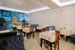 A restaurant or other place to eat at Art Regency Premium Hotel, Free Airport Shuttle Service