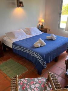 Giường trong phòng chung tại Guesthouse Entre Campo y Mar