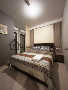 Katil atau katil-katil dalam bilik di 2BR One Residence 23AL City and Sea View