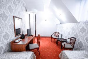 En tv och/eller ett underhållningssystem på Hotel Restauracja Browar Lwów w Lublinie