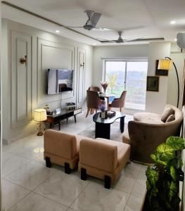 A television and/or entertainment centre at Two-Bedroom Luxury Apartment, Zameen Opal