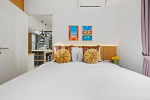 Cama ou camas em um quarto em Kiara by Kozystay - Paskal