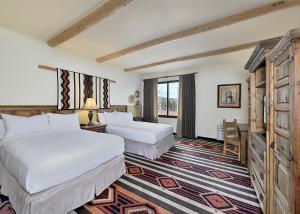 a hotel room with two beds and a large window at The Lodge at Santa Fe in Santa Fe