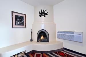 a fireplace in a living room with a fire place at The Lodge at Santa Fe in Santa Fe