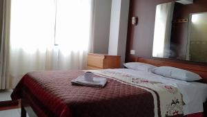 Кровать или кровати в номере hostal nazly