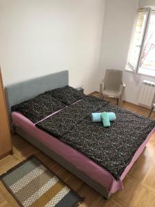 Cama ou camas em um quarto em Apartman Mina