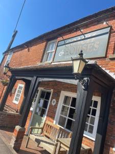 a building with a sign on the front of it at The Coach and Horses in Winchester