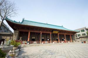 a building with a sign on the front of it at Super 8 Hotel Xian Nanshaomen in Xi'an