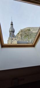 a view of a lighthouse from a window at NOMAD APARTMENTS - Astrid in Dinant