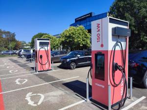 a couple of gas pumps in a parking lot at Best Western Plus Metz Technopole in Metz