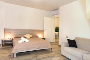 A bed or beds in a room at MOLAROTTO CAMERE CON ANGOLO COTTURA