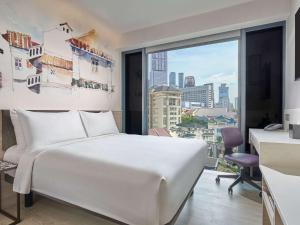 Кровать или кровати в номере Mercure ICON Singapore City Centre