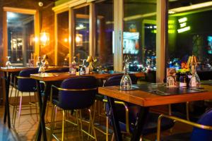 a row of tables and chairs in a restaurant at Marigold Thermal & Spa Hotel Bursa in Bursa