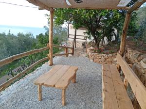 a wooden bench sitting on top of a table at Ελαιώνας - Solar Energy House in Chorefto