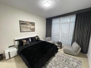 Katil atau katil-katil dalam bilik di Luxury Hotel Apartments - Ajman Corniche UAE