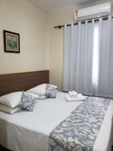 Una cama o camas en una habitación de Hotel Orleans