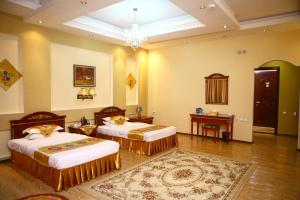 ORIYO DUSHANBE HOTEL में एक कमरे में एक या कई बेड