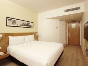 เตียงในห้องที่ ibis Pune Viman Nagar - An Accor Brand