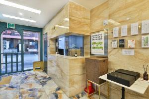 a restaurant with a counter in a room at Hotel Palace Gyeongju in Gyeongju