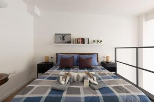 Cama ou camas em um quarto em Moderno e Confortevole Loft tra Navigli e Bocconi