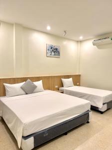 Phúc Đức Hotel 객실 침대