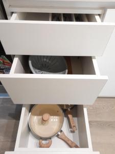 a white drawer with a bowl in a kitchen at Departamento Ejecutivo a Estrenar in Buenos Aires