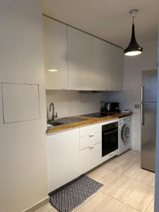 Η κουζίνα ή μικρή κουζίνα στο Joli appartement 49 m² proche centre Paris,