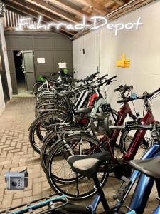 a bunch of bikes parked in a garage at Hotel Hinrichs in Carolinensiel